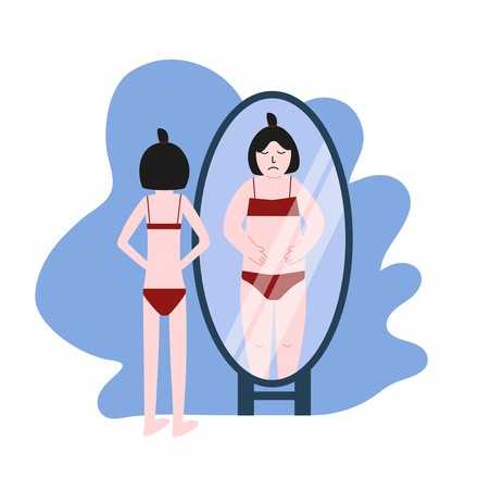 Frau mit Body Dysmophia vor dem Spiegel. (Foto: ©stock.adobe.com/Anastasia)
